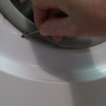 removing retaining clip on mouldy Washing Machine Door Seal